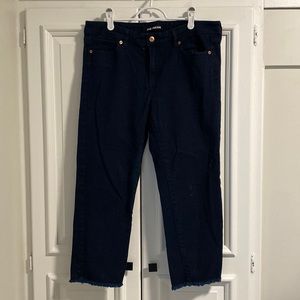 Denim capris with tattered bottoms